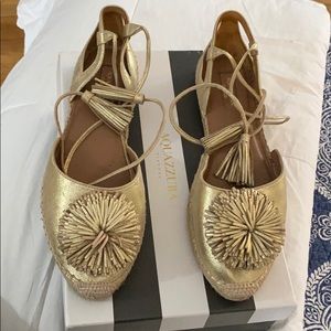 Gold flat with tie around ankle